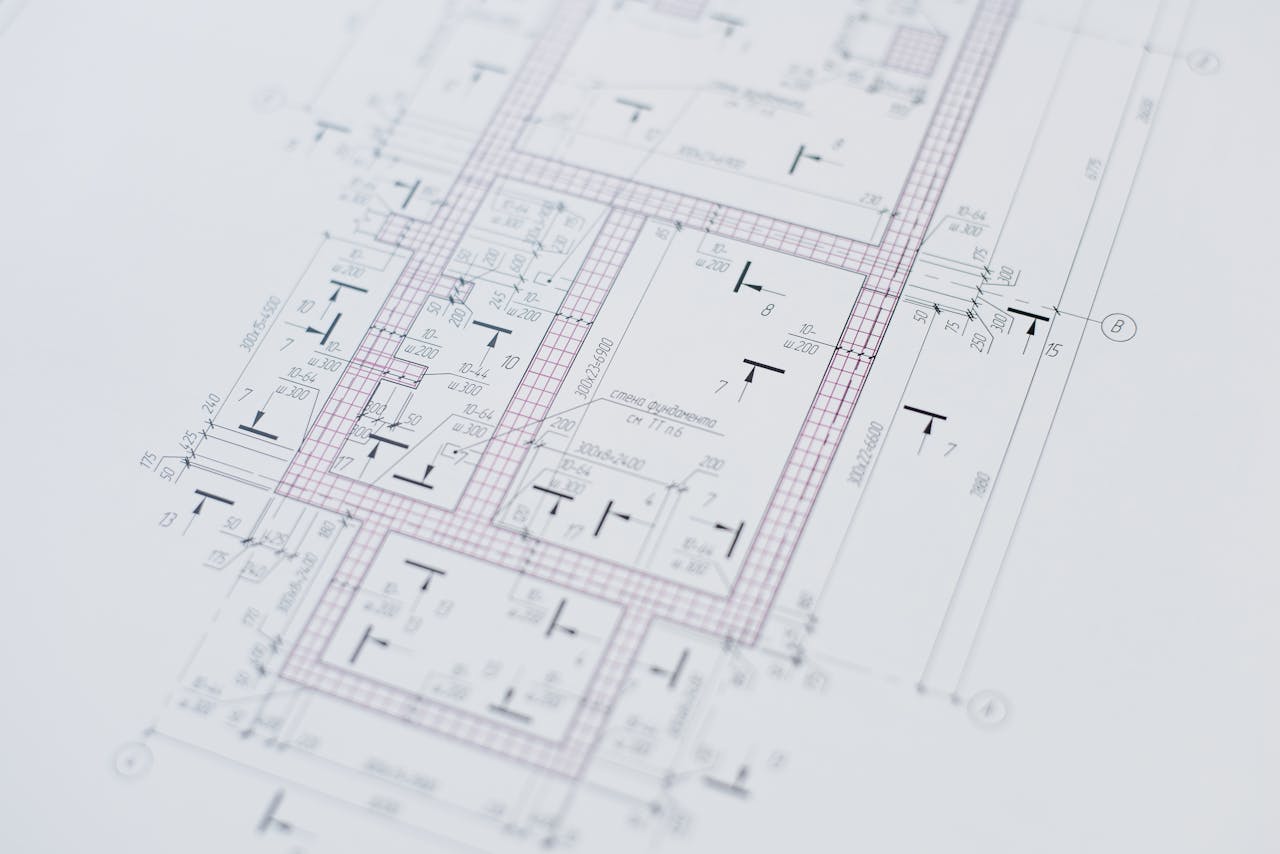about-02 Close-up view of an architectural floor plan showcasing design creativity and layout precision.